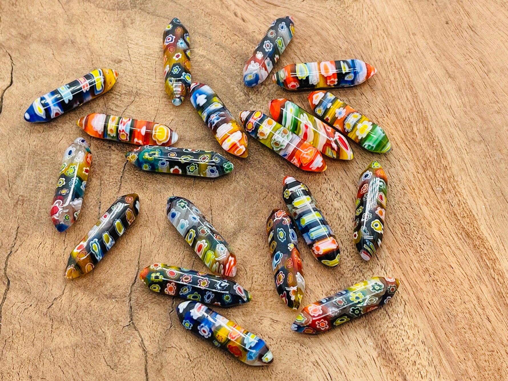 Murano glass terminated carved point gemstone from GemstoneGO, 3cm, with intricate details and vibrant colors.