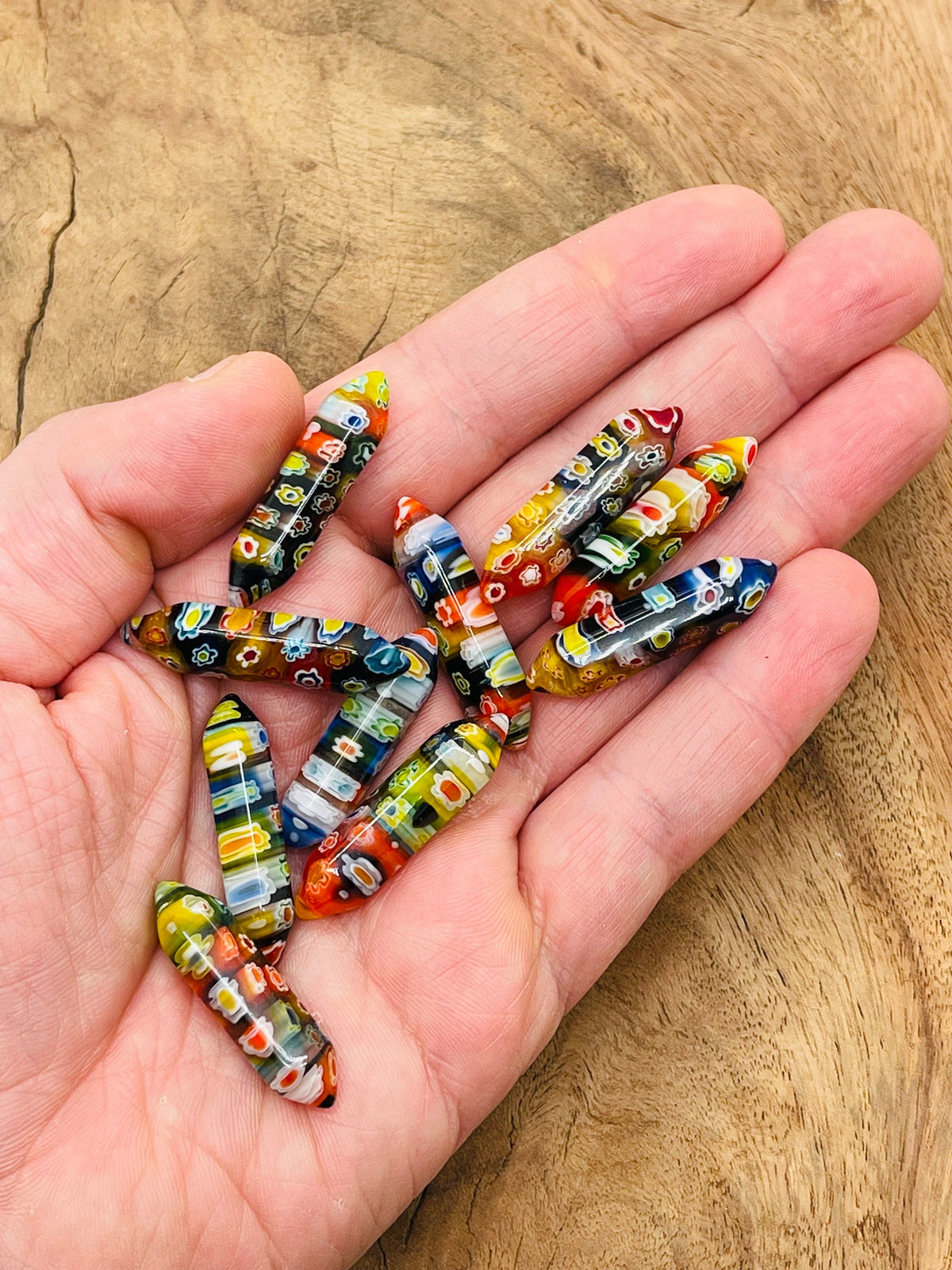 Murano glass terminated carved point gemstone from GemstoneGO, 3cm in length, showcasing intricate glasswork and vibrant color details.