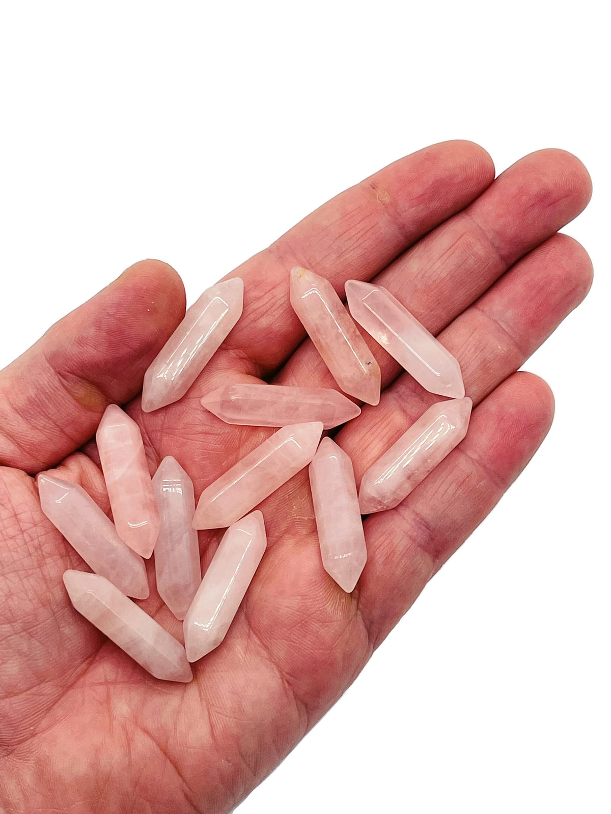 Rose Quartz terminated carved point gemstone from GemstoneGO, 33mm polished crystal with pointed tip and natural pink hue.