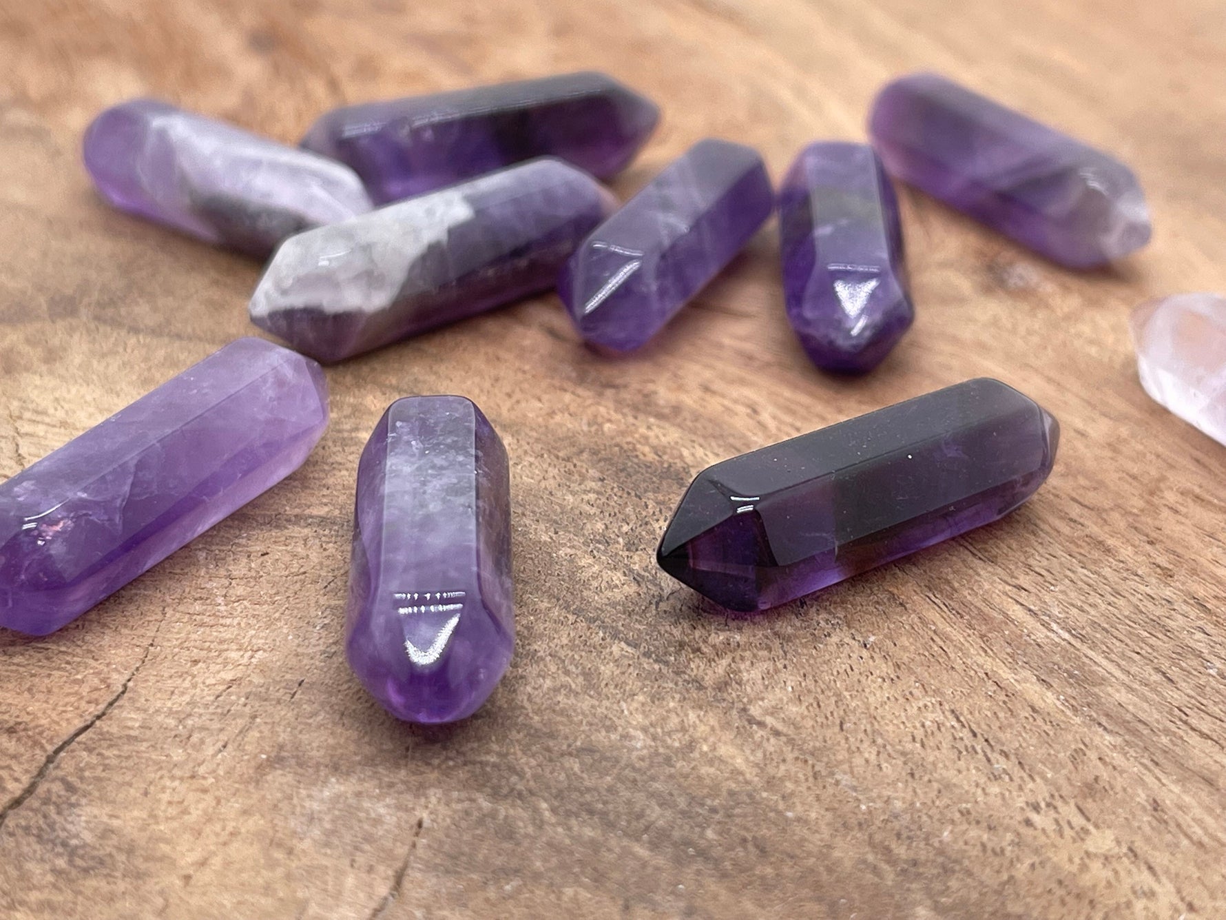 Amethyst terminated carved point gemstone from GemstoneGO, 33mm, showcasing a purple amethyst crystal with detailed carvings.