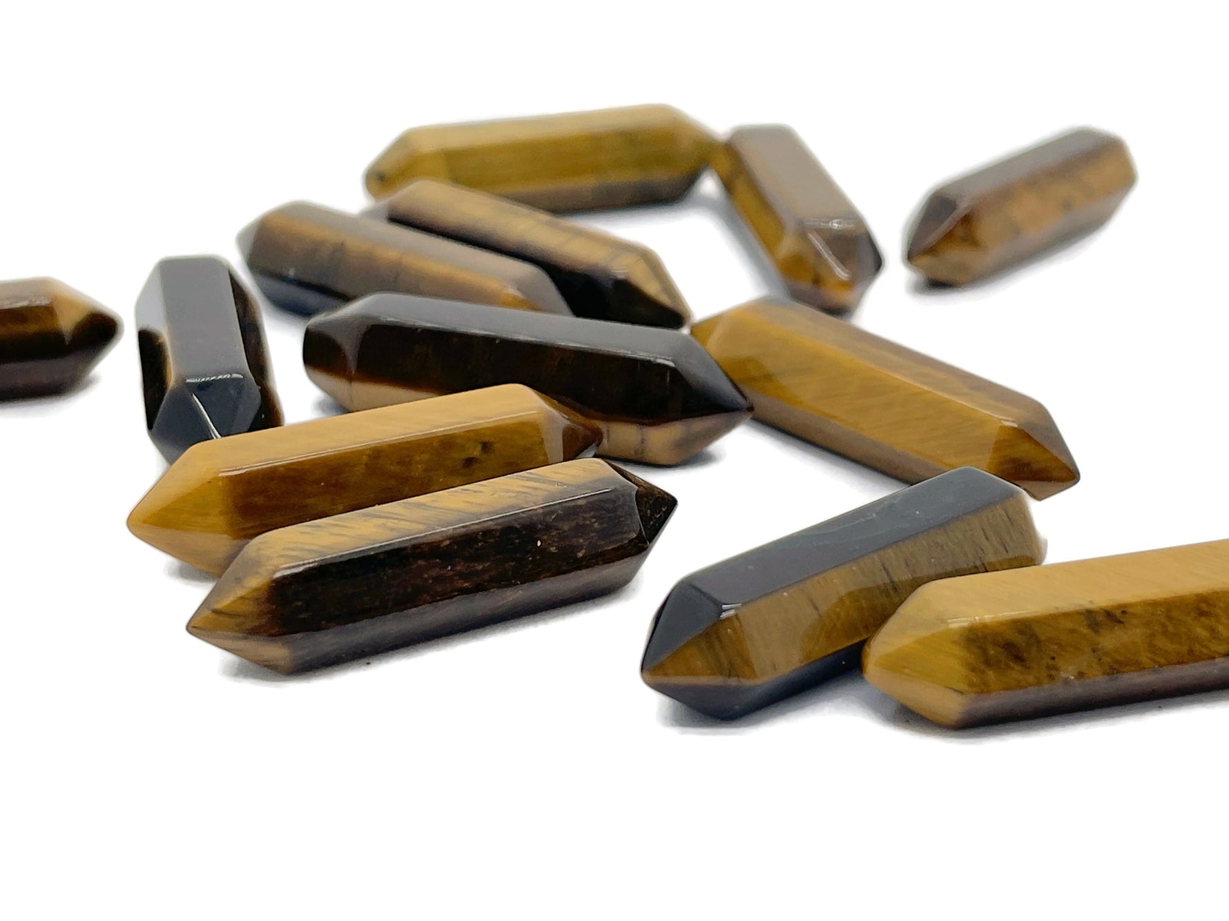Tiger Eye carved point crystal pendant, 33mm, with natural gemstone details from GemstoneGO.