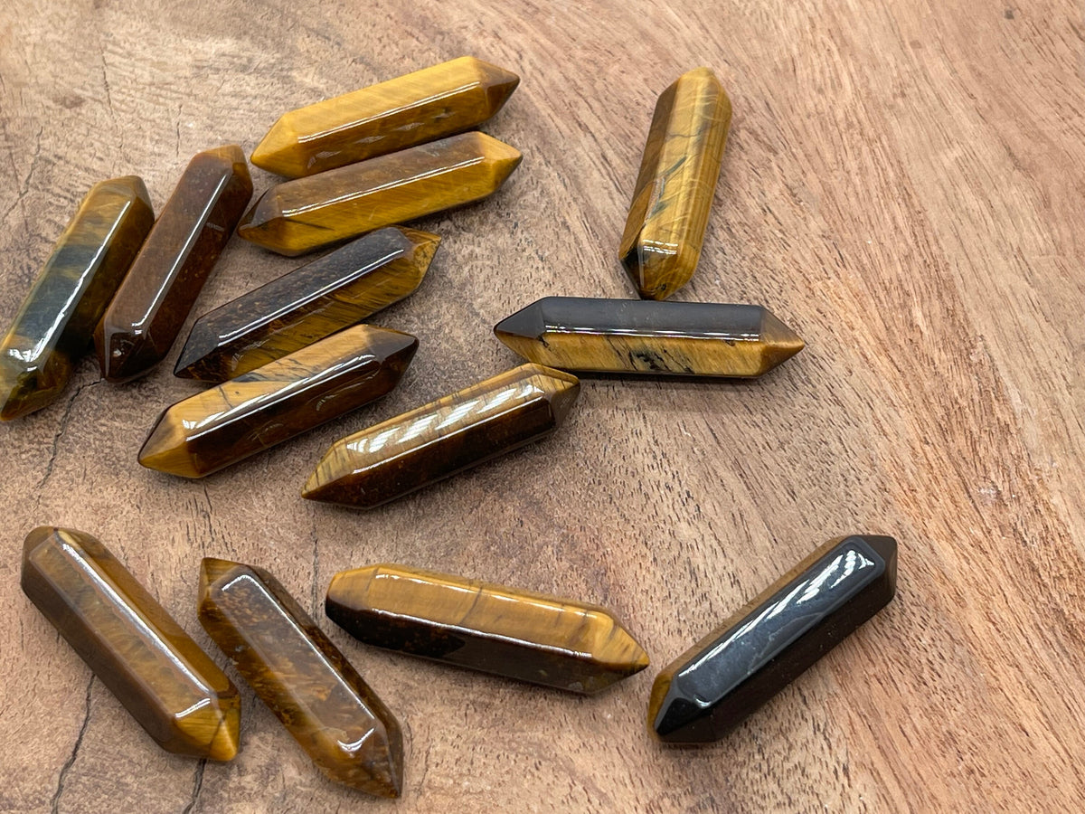 Tiger Eye terminated carved point gemstone, 33mm, from GemstoneGO, showing polished, natural stone with a pointed, carved tip.