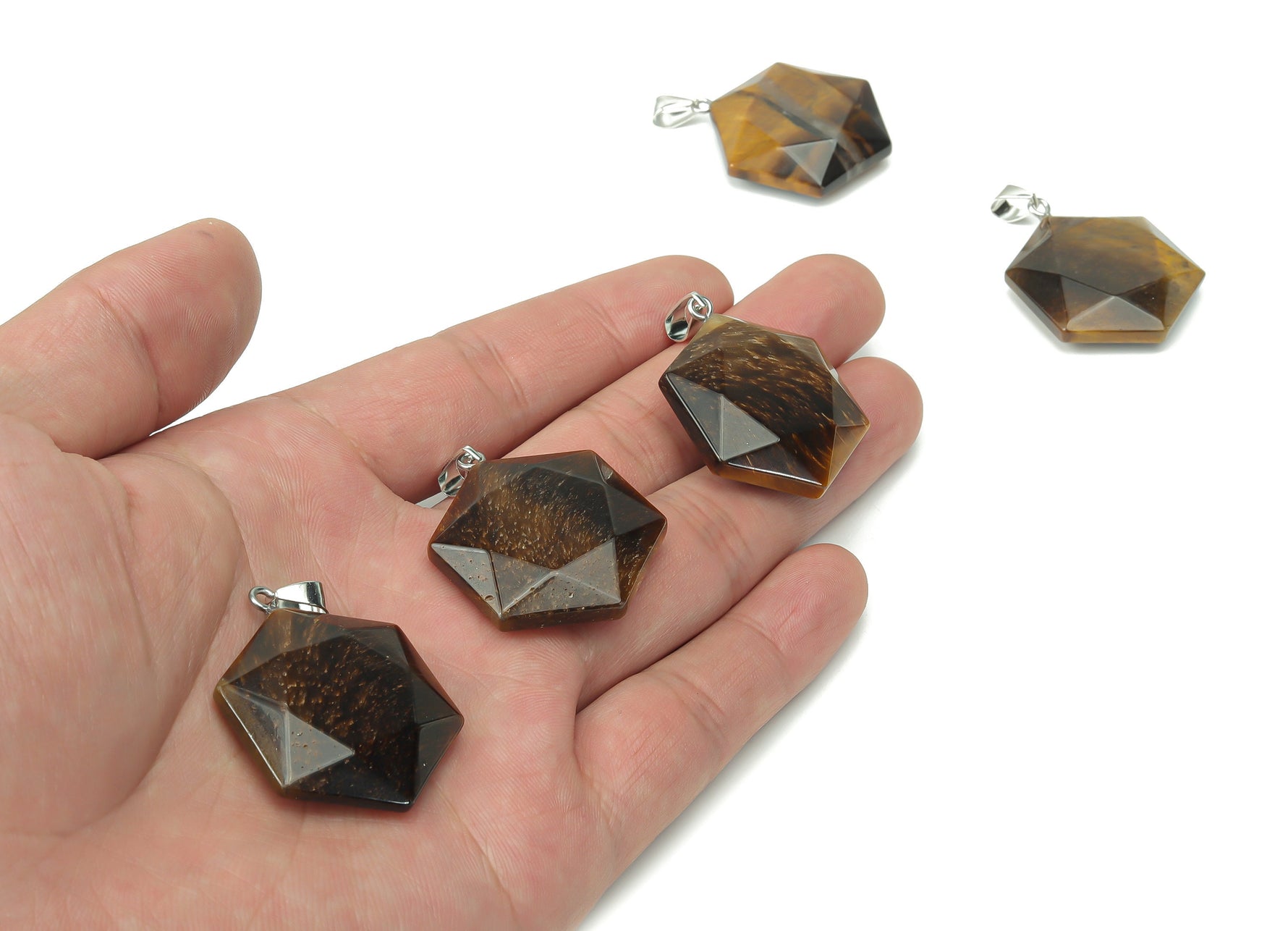Tiger Eye Star Merkaba crystal pendant from GemstoneGO, featuring a polished gemstone pendant with star and Merkaba shapes for jewelry.