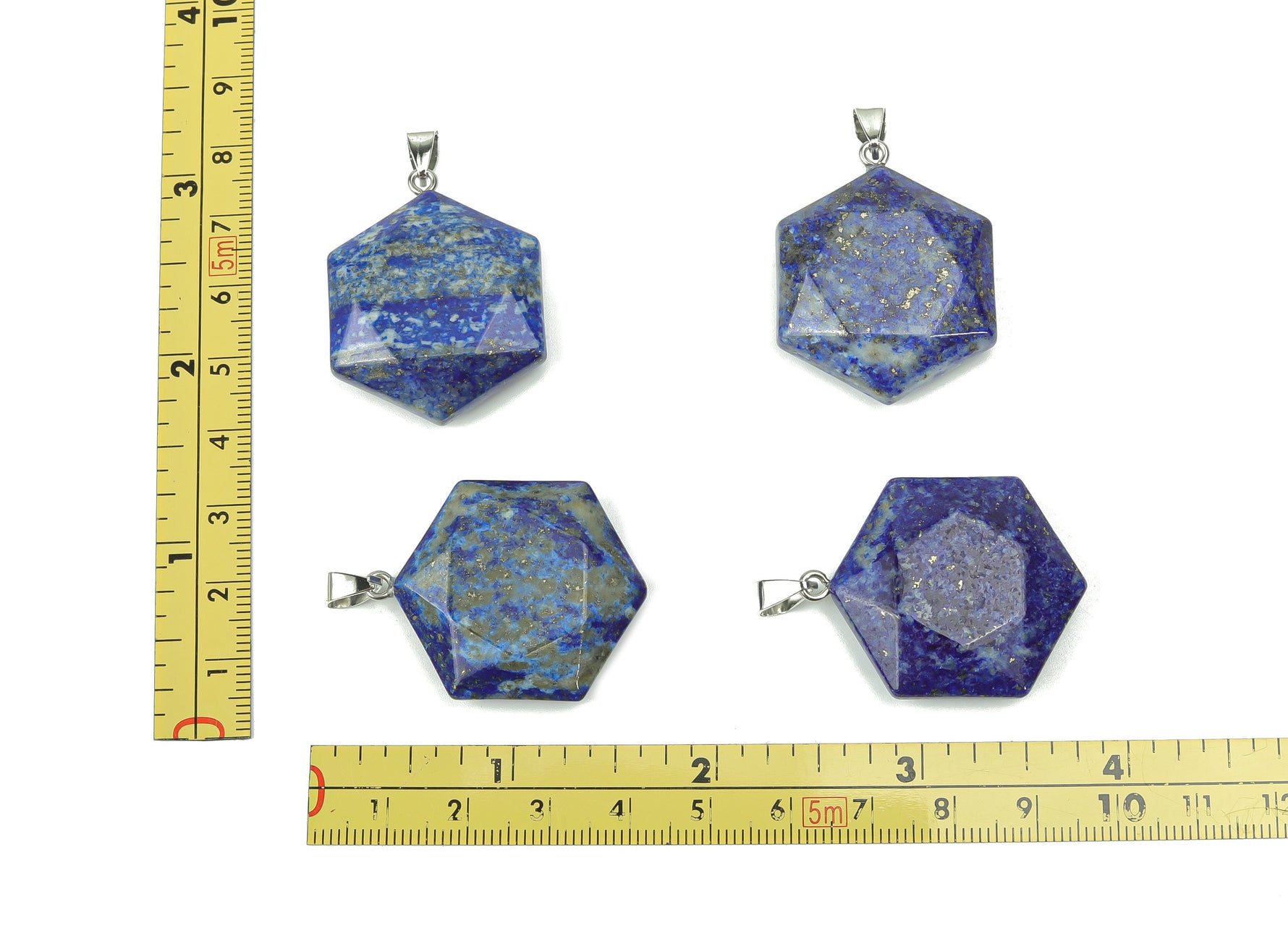 Lapis Lazuli star Merkaba pendant by GemstoneGO, showcasing a deep blue gemstone with gold flecks on a jewelry making supply background.