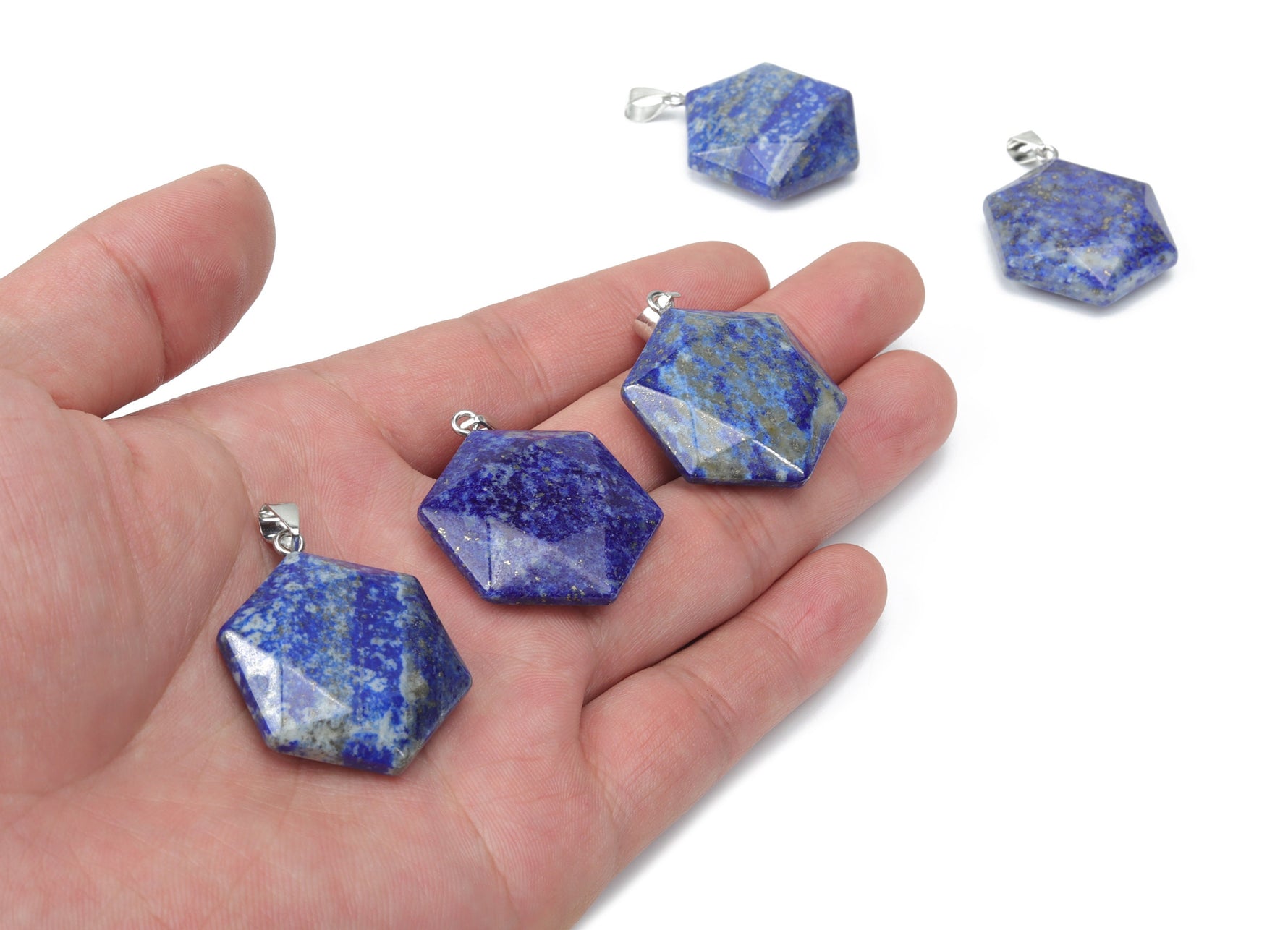 Lapis Lazuli star Merkaba pendant from GemstoneGO, made of vibrant blue gemstone with gold accents, suitable for jewelry making.