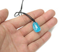 Blue Aura Quartz crystal necklace on a cord, featuring a vibrant gemstone pendant, perfect for gift-giving by GemstoneGO.