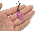 Purple aura quartz crystal necklace on a cord, featuring a polished purple gemstone pendant, ideal for jewelry and gift displays.