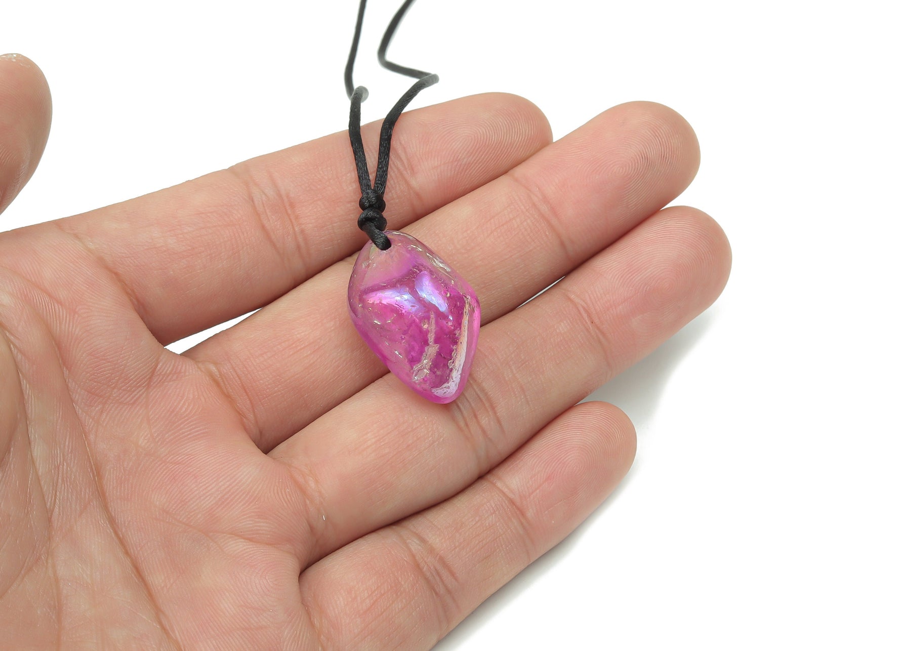 Purple aura quartz crystal necklace on a cord, featuring a polished purple gemstone pendant, ideal for jewelry and gift displays.