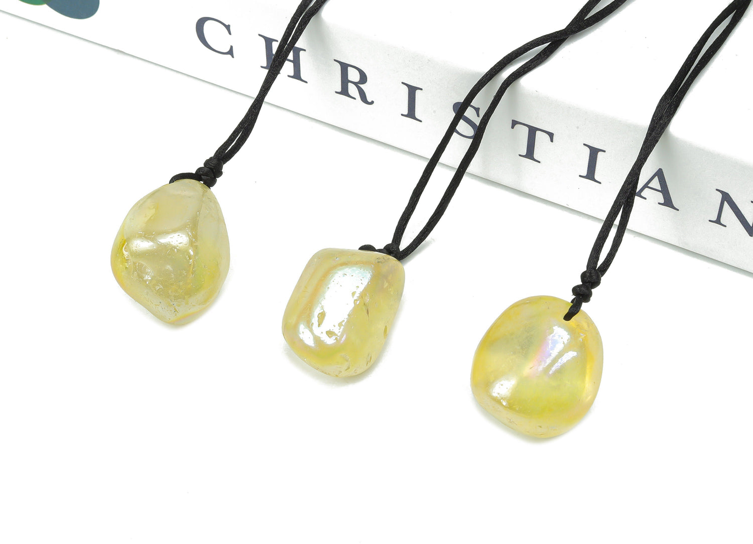 Yellow Aura Quartz crystal necklace on a cord, featuring a polished gemstone pendant from GemstoneGO.