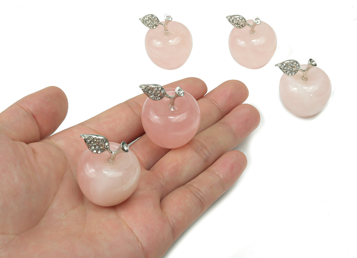 Rose quartz apple-shaped crystal carving from GemstoneGO, 30mm, with smooth polished surface and natural pink gemstone details.