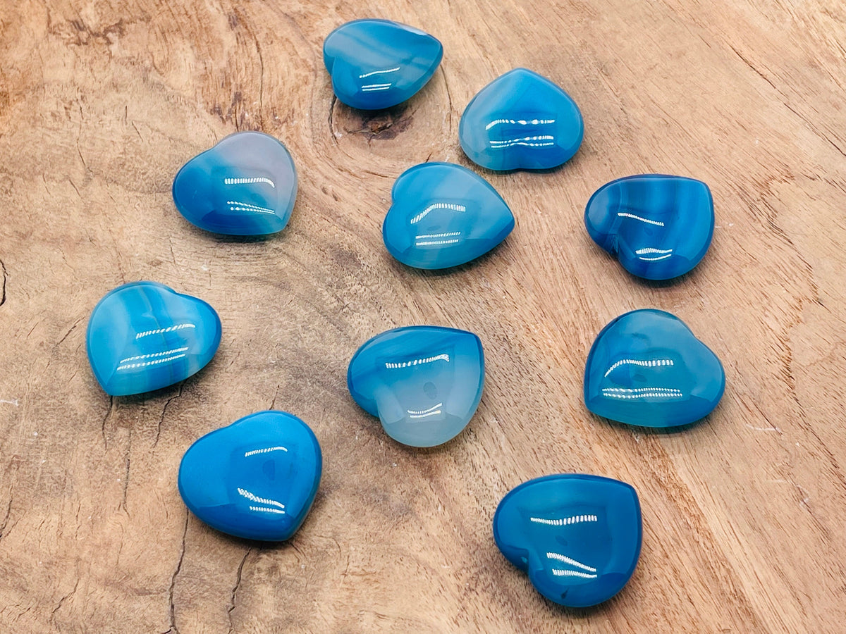 Blue Agate Heart-shaped gemstone from GemstoneGO, 30mm, showing vibrant blue color and smooth polished surface.