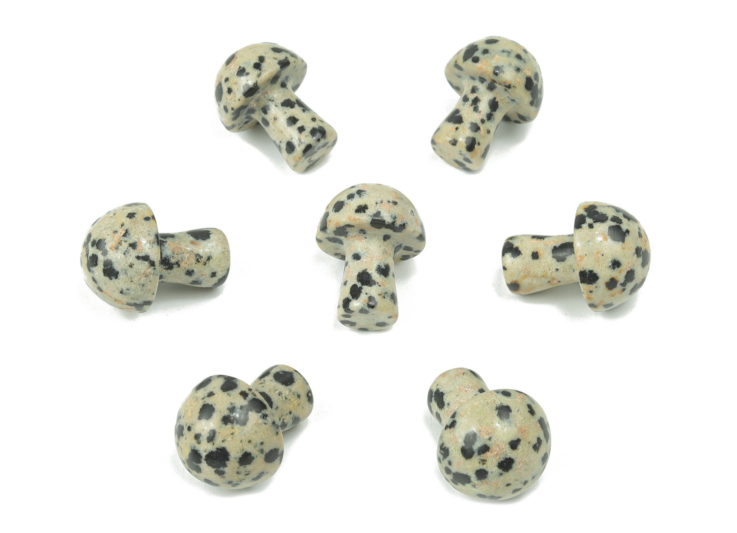 Dalmatian Jasper mushroom carved gemstone, 20mm, showing black spots on cream-colored stone with a natural textured surface.