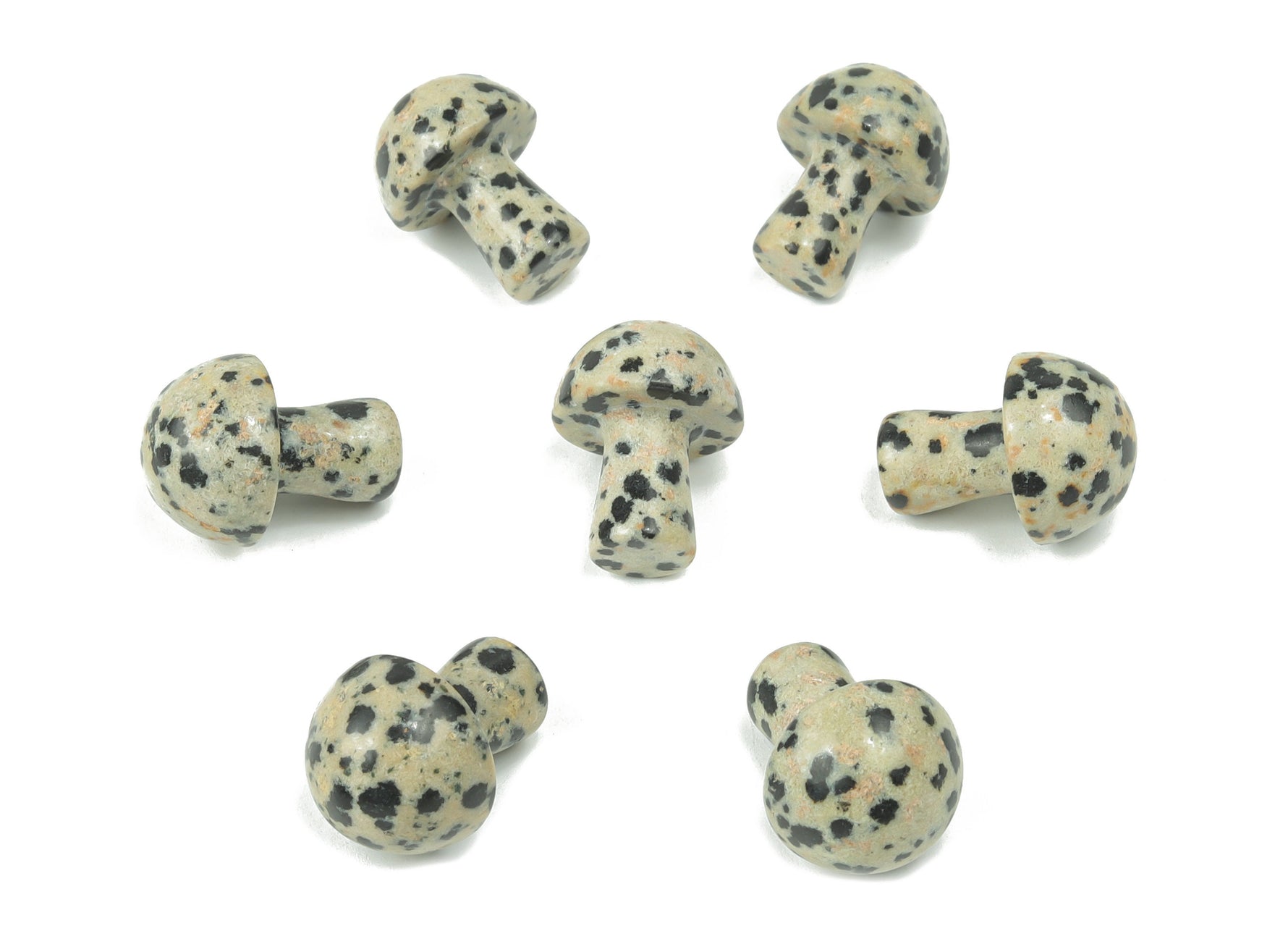 Dalmatian Jasper mushroom carved gemstone, 20mm, showing black spots on cream-colored stone with a natural textured surface.