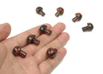 Mahogany Obsidian mushroom carved gemstone, 20mm, showing detailed natural stone texture and smooth rounded shape.