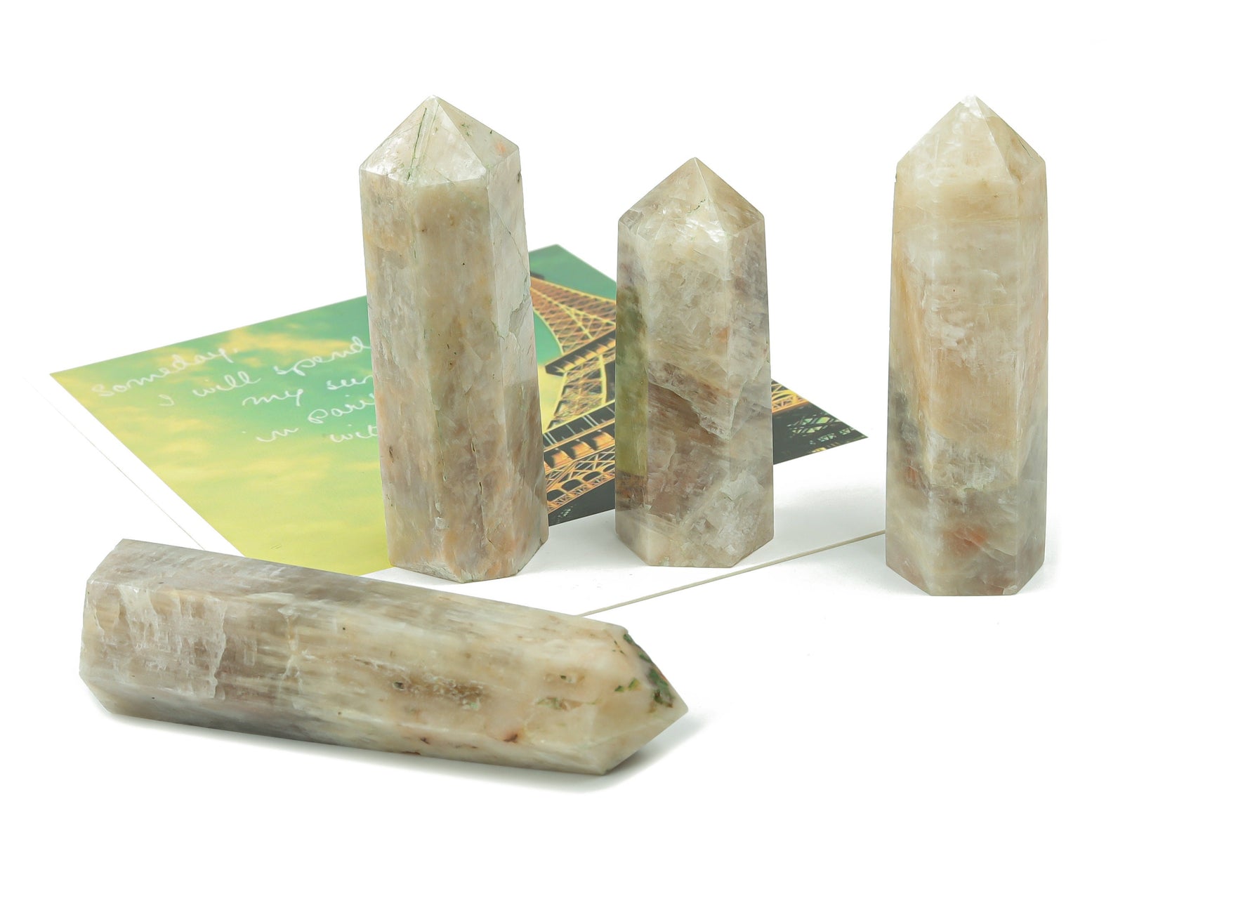 Moonstone obelisk tower crystal from GemstoneGO, featuring a polished, translucent moonstone with natural veining and smooth pointed tip.