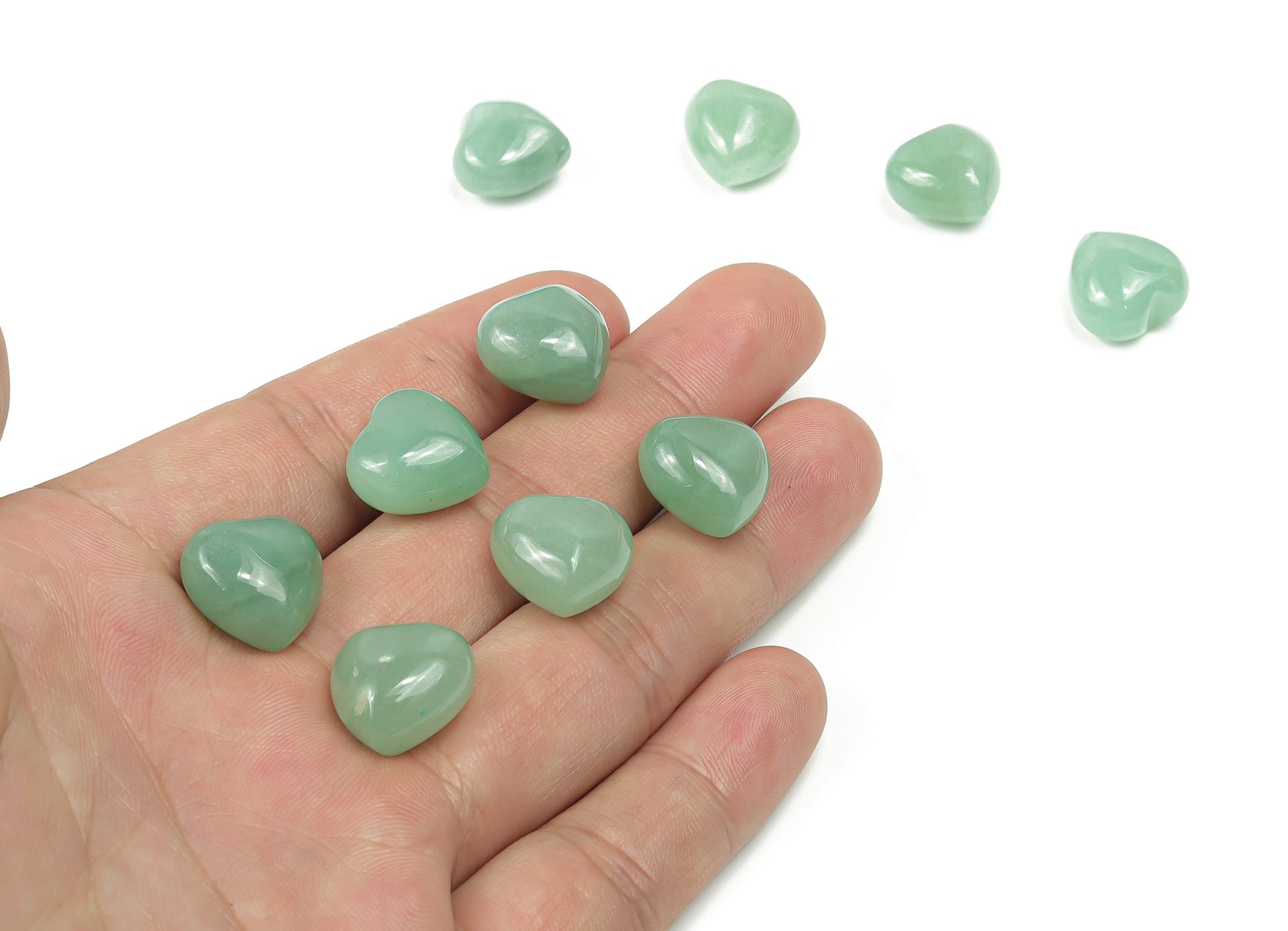 Puffy heart-shaped aventurine gemstone 15x15x9mm with vibrant green color, smooth polished surface, and natural stone details.