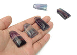 Fluorite flat tower gemstone carving by GemstoneGO, showcasing vibrant purple and green hues with smooth polished surface.