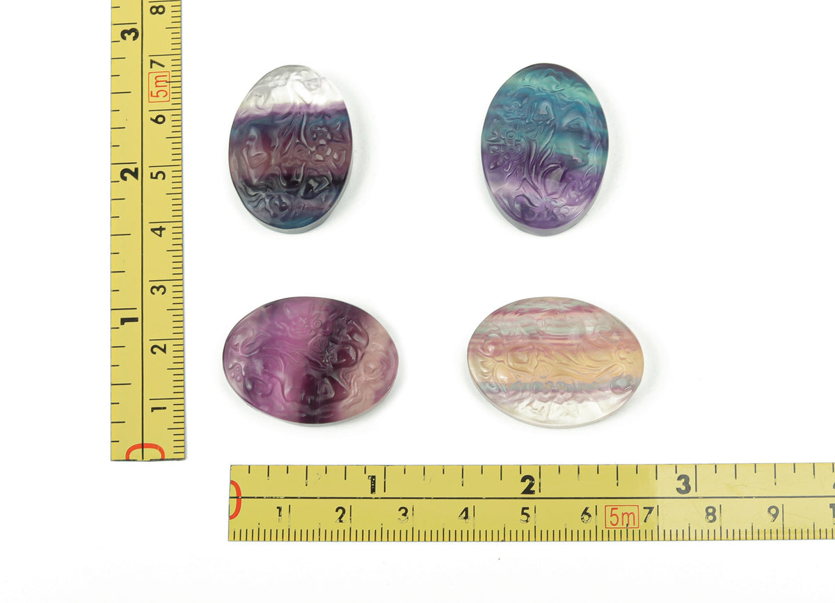 Fluorite lady portrait gemstone carving by GemstoneGO showcasing intricate details and vibrant purple-green hues.