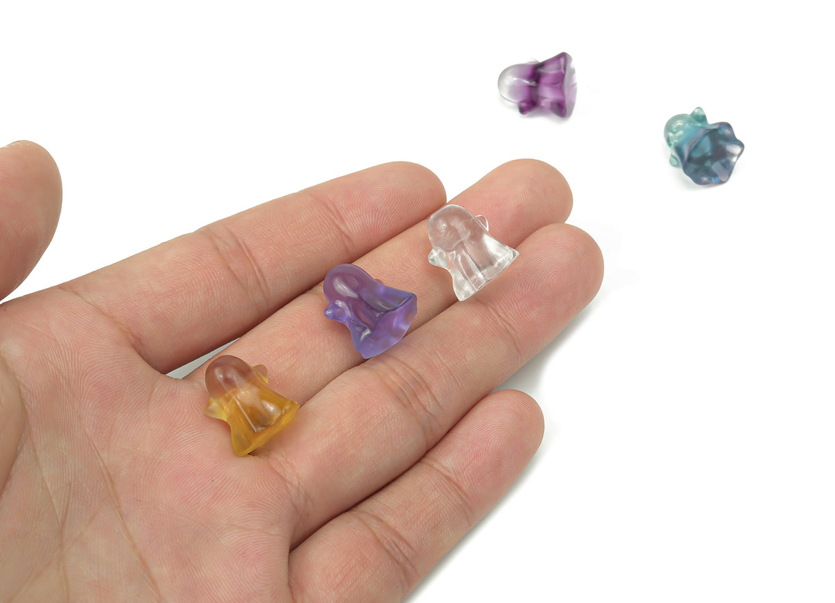 Mini fluorite ghost carving gemstone from GemstoneGO, featuring vibrant purple and green hues with detailed ghost sculpture.