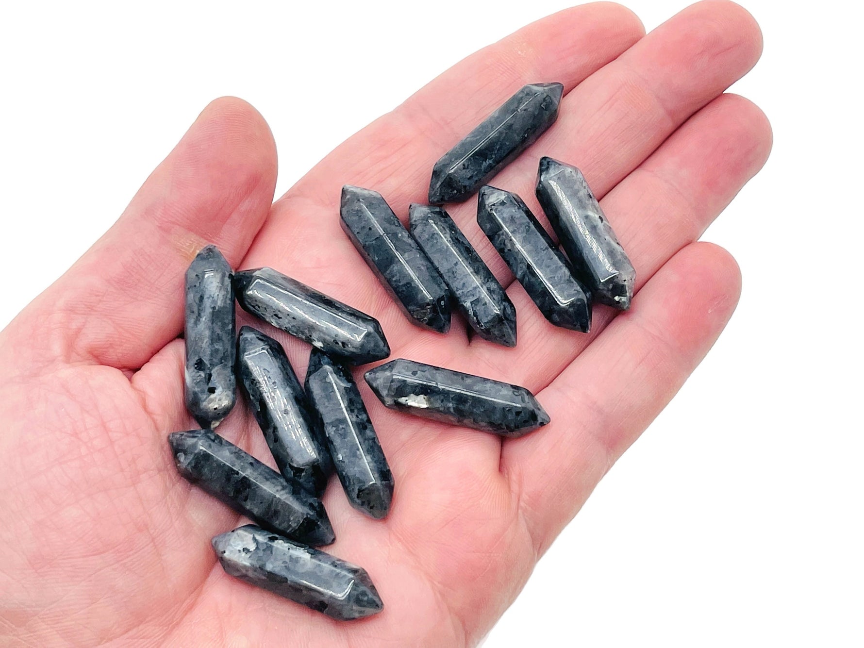 Larvikite terminated carved point gemstone, 33mm, from GemstoneGO, featuring a polished, natural stone with intricate patterns and a pointed tip.