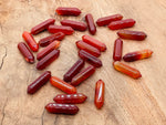 Carnelian gemstone carved point, 33mm terminated crystal with detailed carving, from GemstoneGO.
