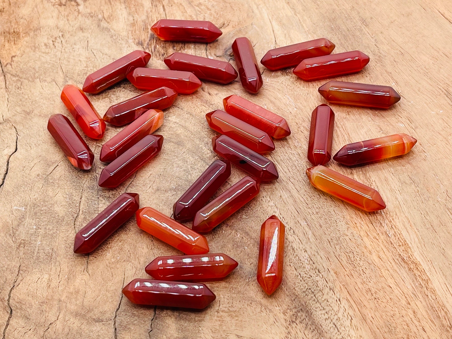 Carnelian gemstone carved point, 33mm terminated crystal with detailed carving, from GemstoneGO.