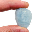 Aquamarine tumbled gemstone from GemstoneGO, smooth blue-green mineral with polished surface, used for jewelry or meditation.