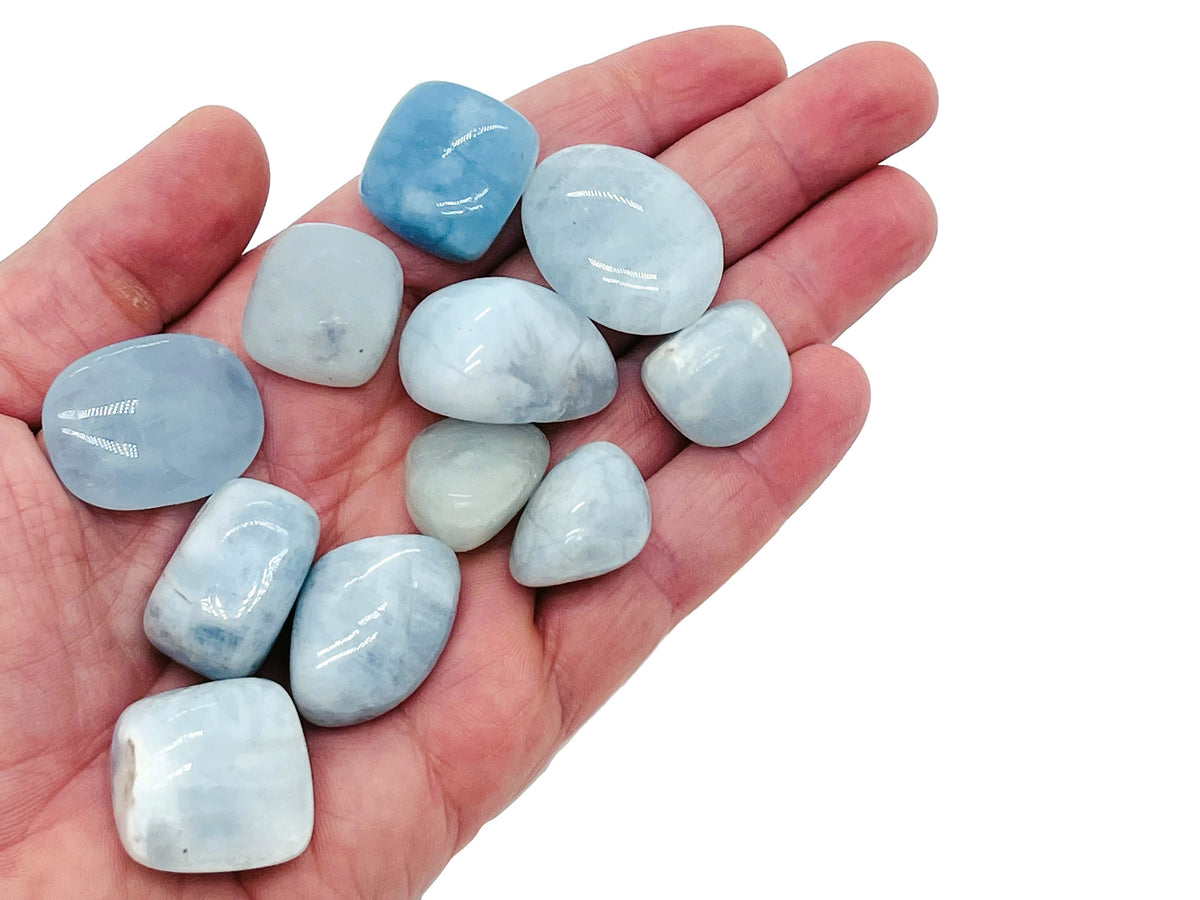 Smooth aquamarine tumbled stone from GemstoneGO, showcasing its light blue, polished surface and natural mineral texture.