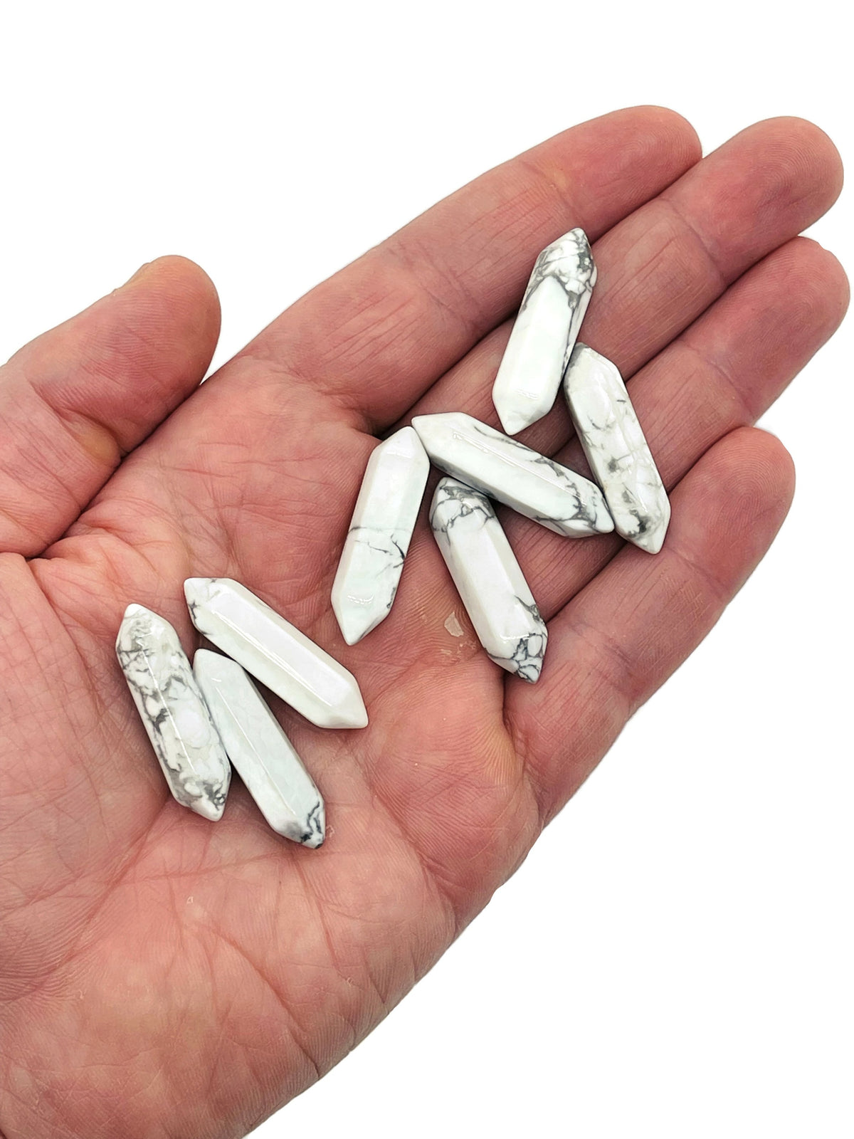 Howlite terminated carved point gemstone in 33mm size, featuring smooth white stone with gray veining, from GemstoneGO.