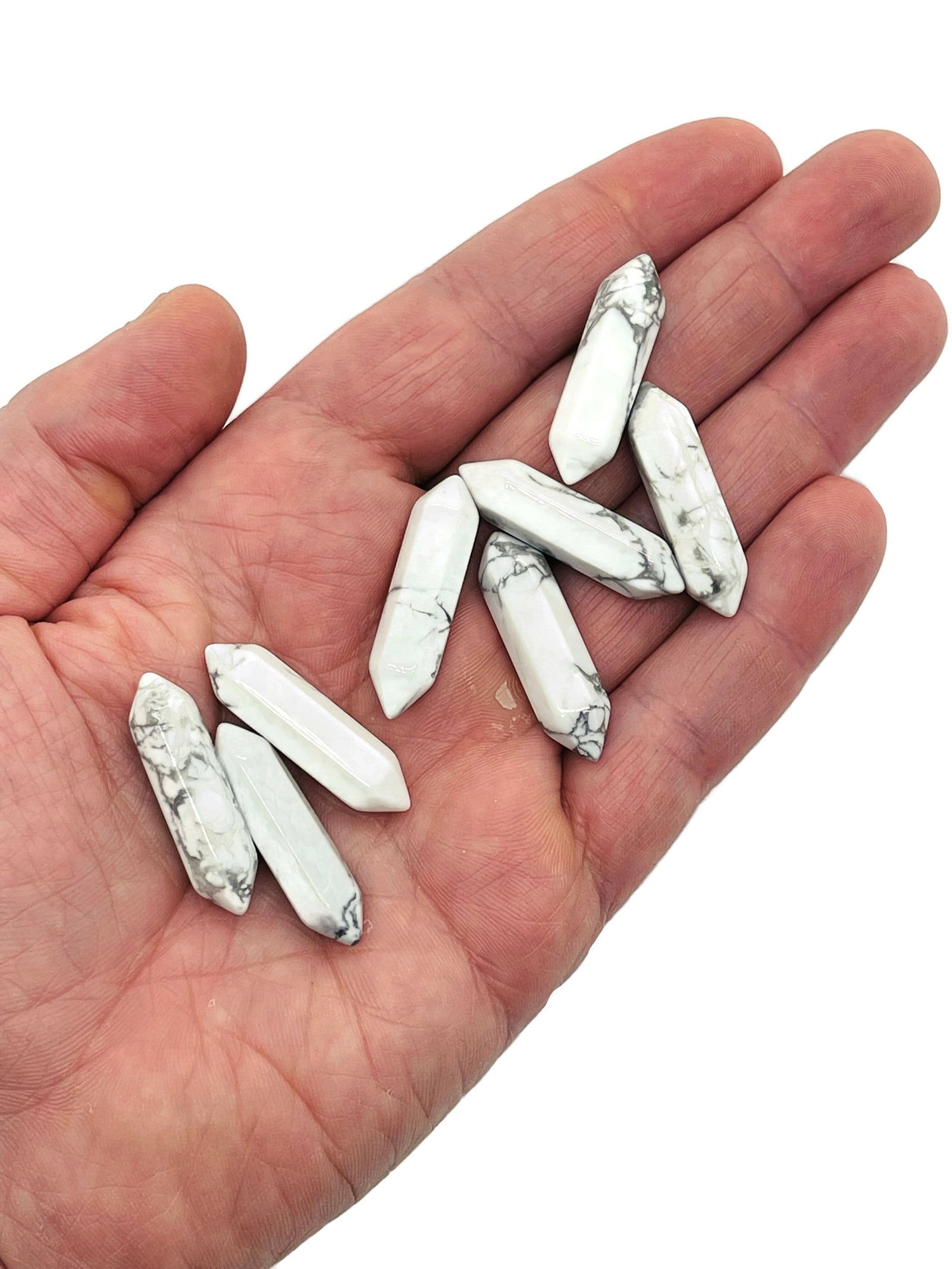 Howlite terminated carved point gemstone in 33mm size, featuring smooth white stone with gray veining, from GemstoneGO.