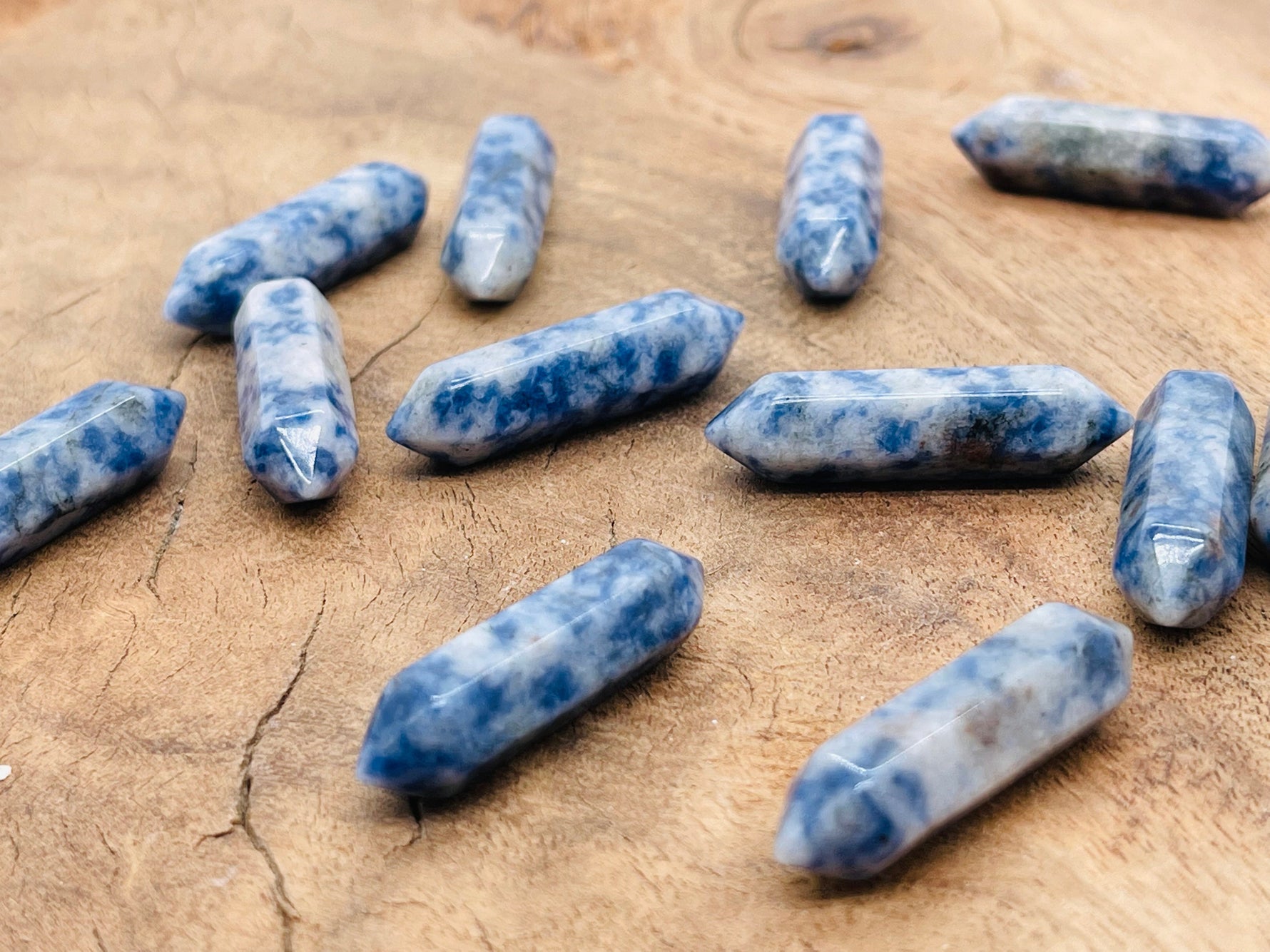 Blue Spot Jasper carved point gemstone, 33mm, showing intricate natural patterns and a polished, terminated shape from GemstoneGO.