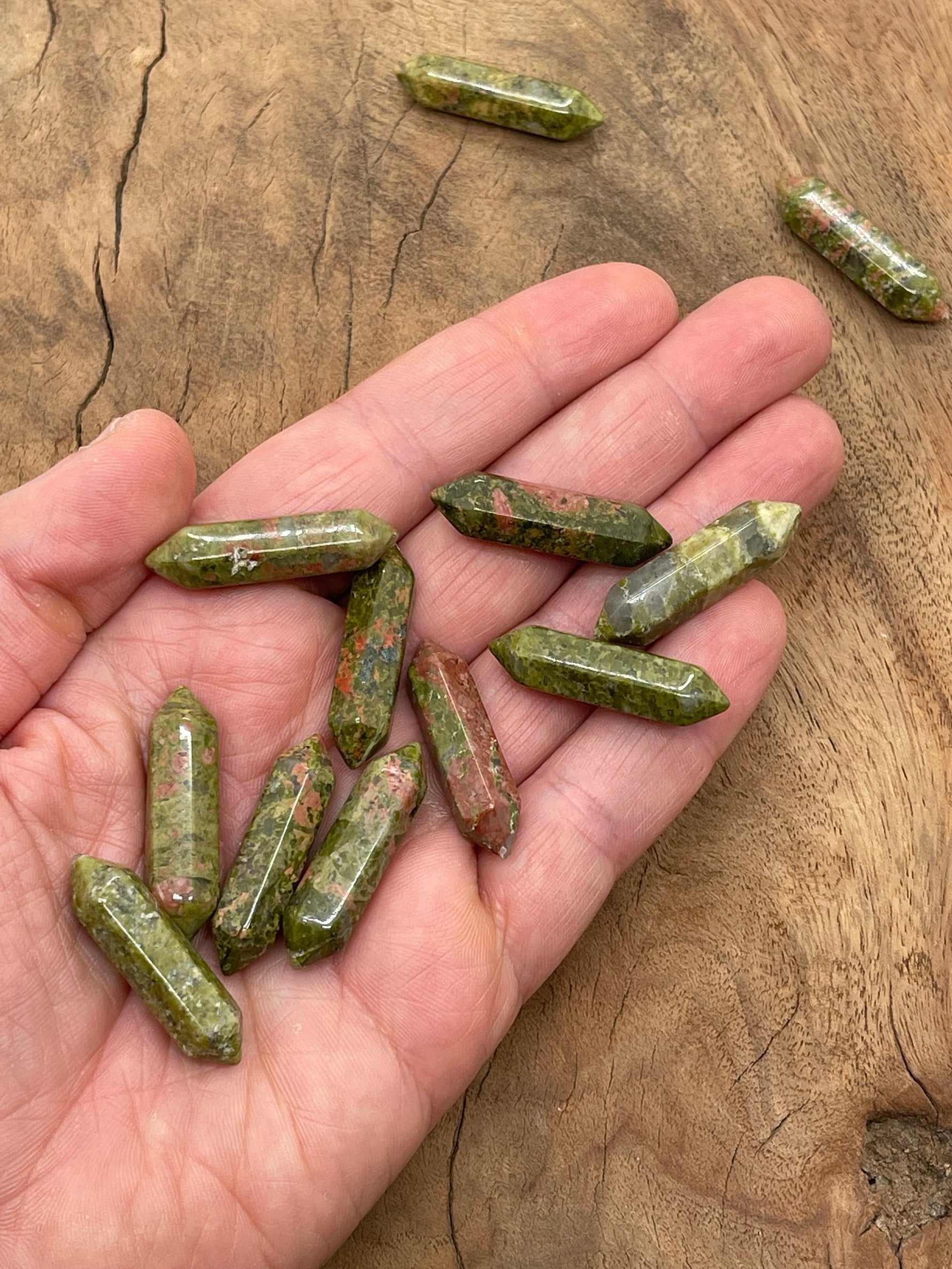 Unakite terminated carved gemstone point, 33mm, from GemstoneGO, showing vibrant green and peach-orange mineral patterns.