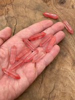 Cherry Quartz terminated carved point gemstone from GemstoneGO, 33mm, showcasing its vibrant red color and detailed carving.