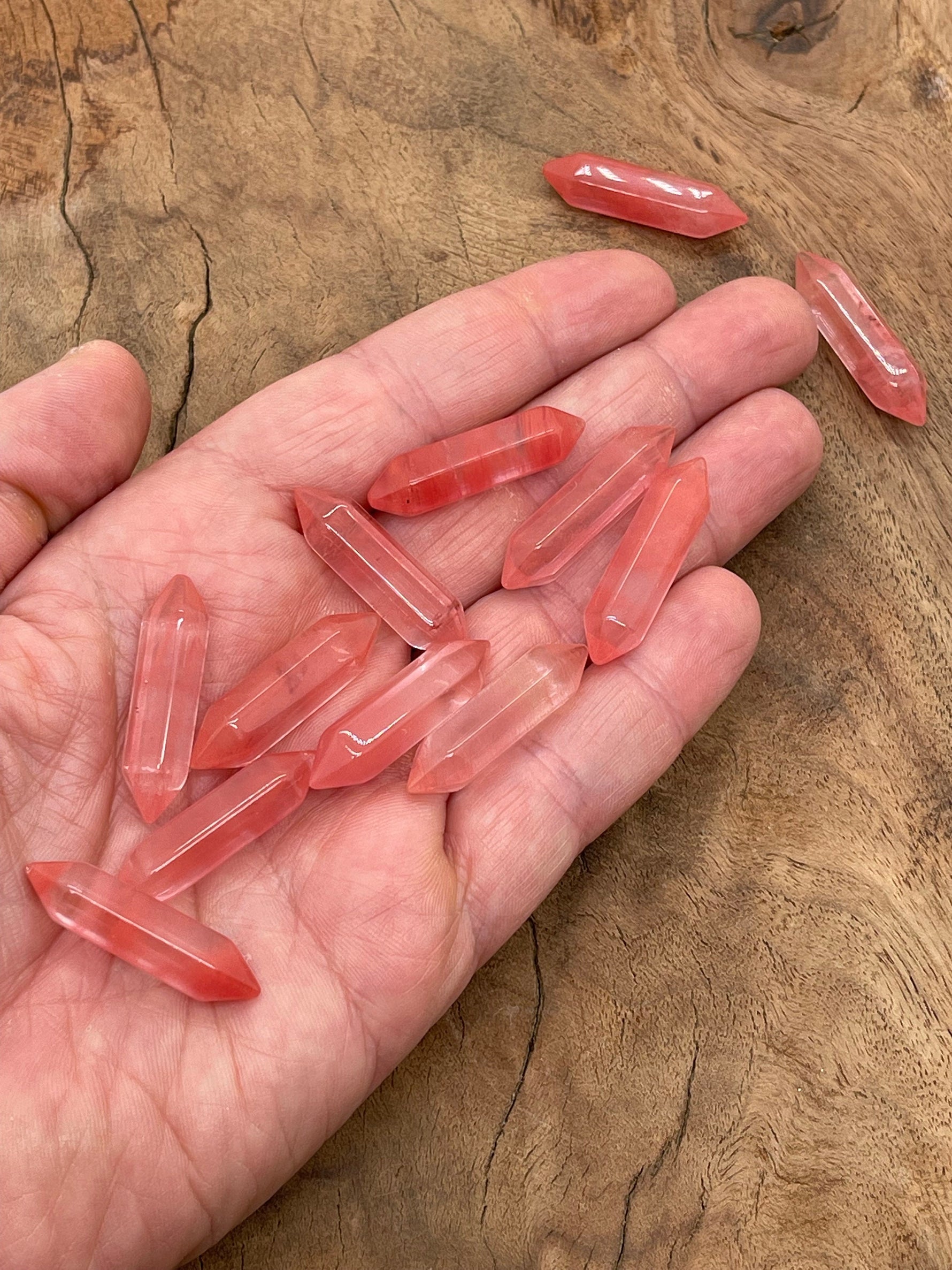 Cherry Quartz terminated carved point gemstone from GemstoneGO, 33mm, showcasing its vibrant red color and detailed carving.