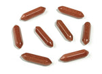 Golden Goldstone terminated carved point gemstone, 33mm, from GemstoneGO, featuring intricate carving and a shiny, reflective surface.