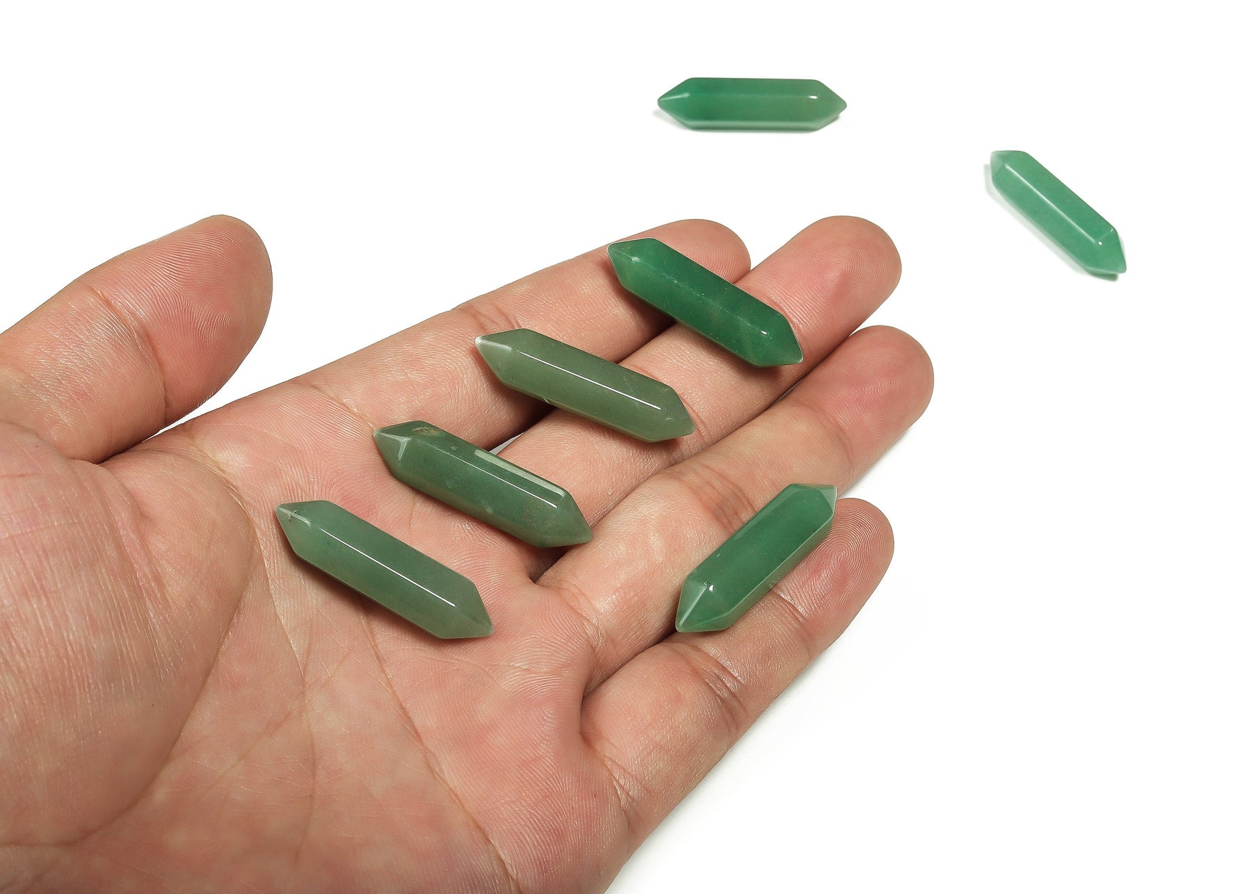 Aventurine terminated carved point gemstone, 33mm, from GemstoneGO, showing a polished green mineral with natural patterns and pointed tip.