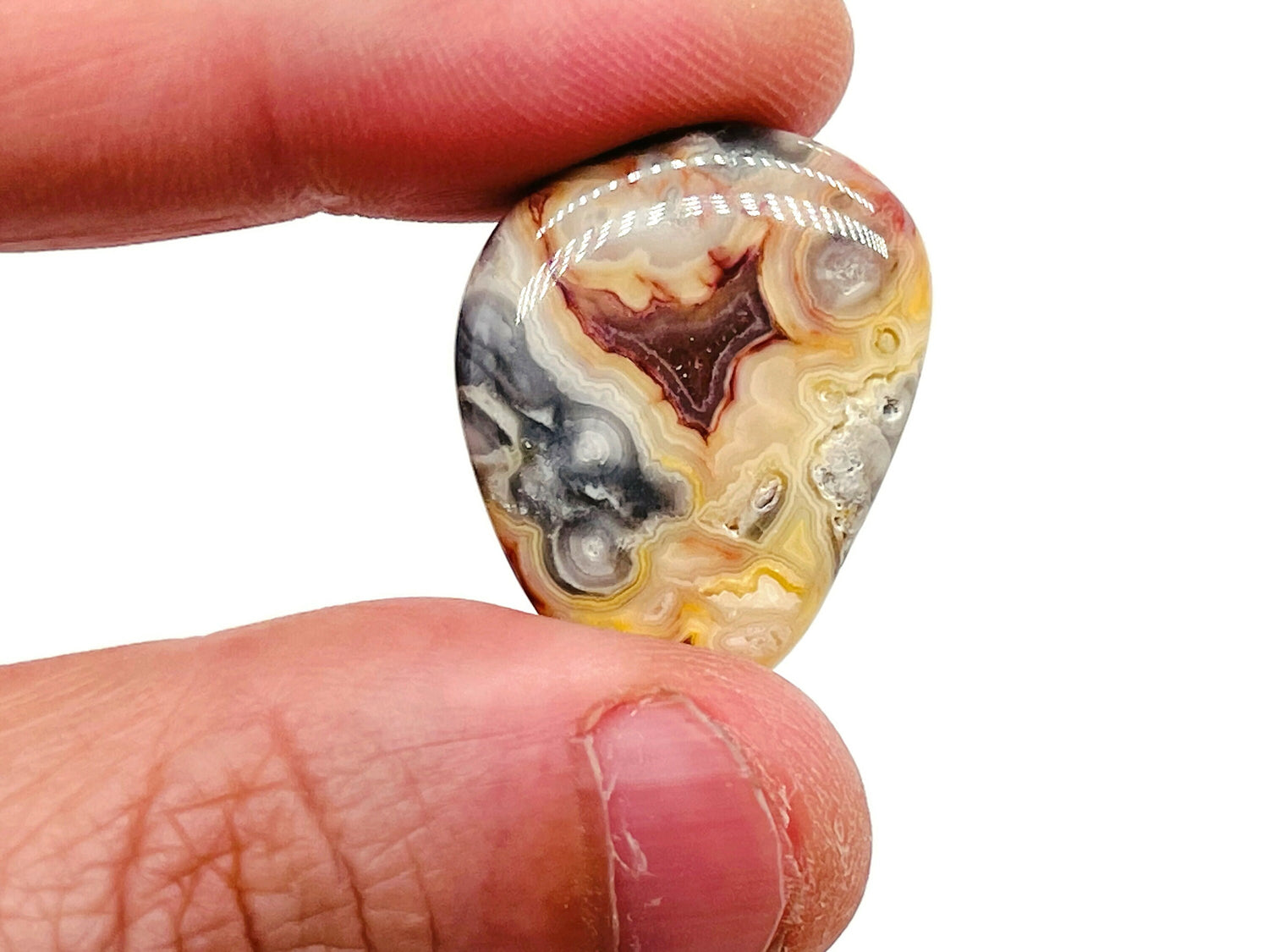 Crazy Lace Agate tumbled stone from GemstoneGO, showcasing colorful Mexican agate with intricate banding and unique natural patterns.