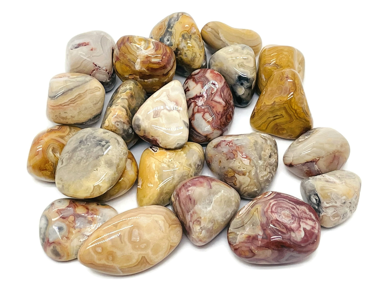 Tumbled Crazy Lace Agate stone from Mexico, showcasing vibrant patterns and colors in a smooth, polished gemstone.