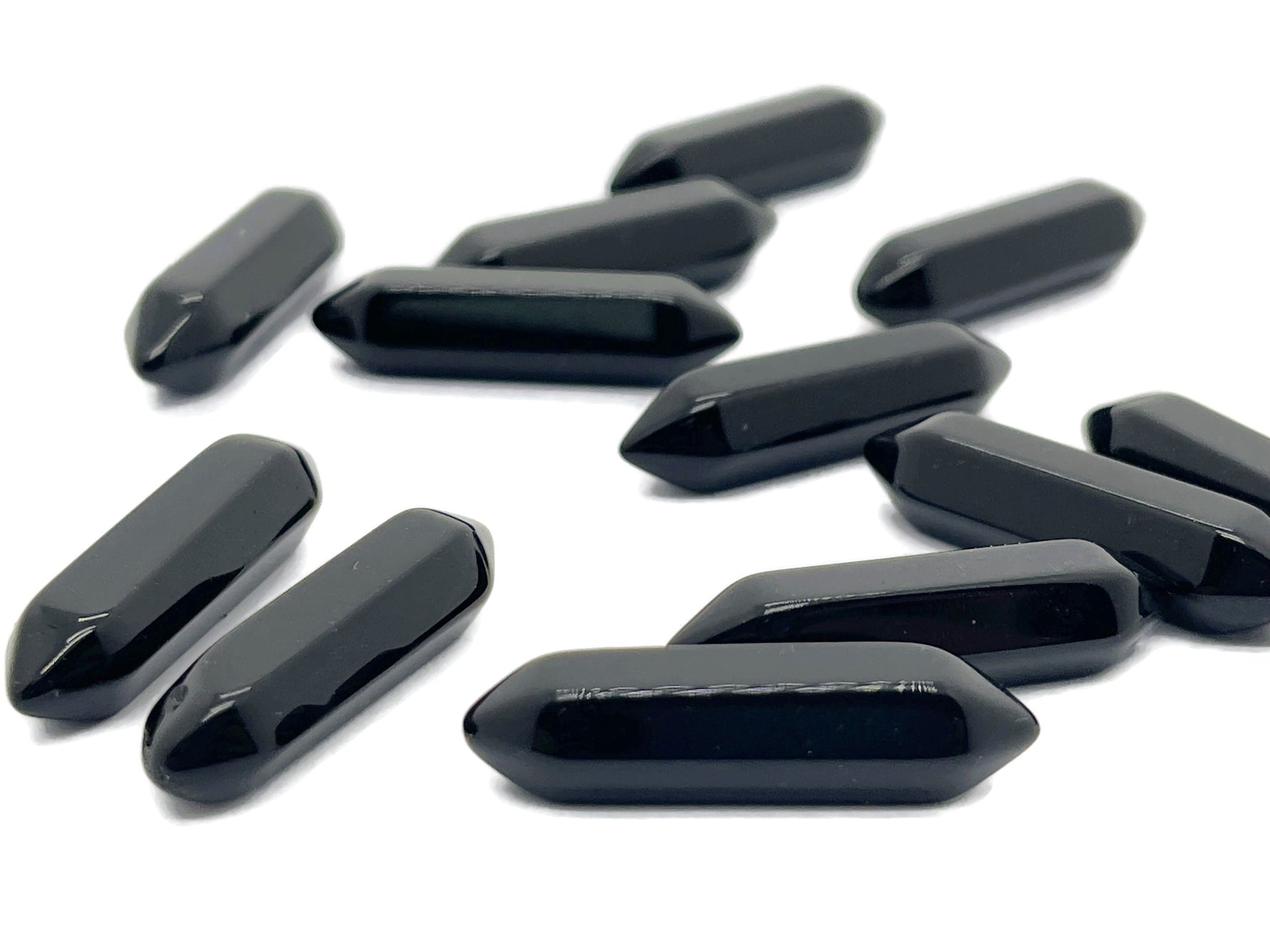 Obsidian terminated carved point gemstone pendant from GemstoneGO, 33mm long, with detailed carving and polished finish.