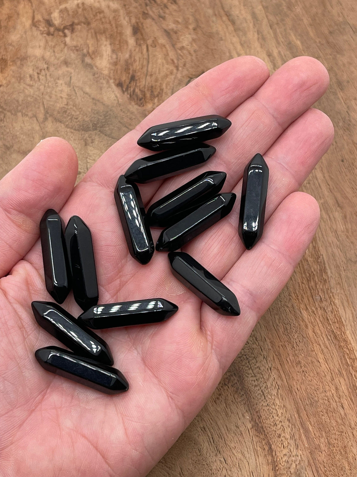 Obsidian terminated carved point gemstone from GemstoneGO, 33mm length with detailed carving and smooth polished surface.