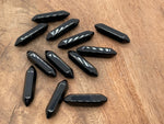 Obsidian terminated carved point gemstone from GemstoneGO, 33mm, with intricate carving and polished surface.