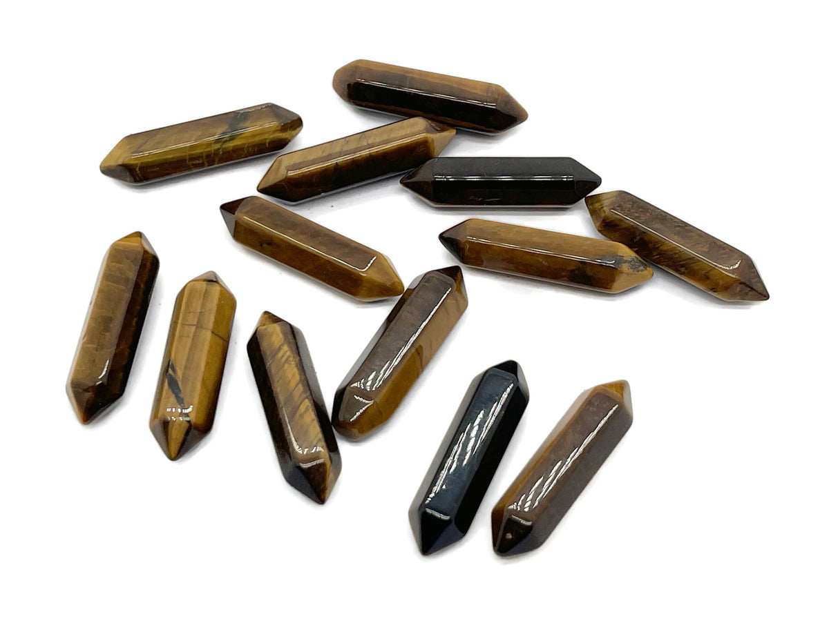 Tiger Eye terminated carved point gemstone, 33mm, from GemstoneGO, featuring a polished, natural stone with a pointed shape.