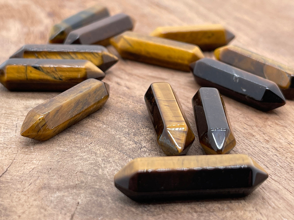 Tiger Eye carved point gemstone, 33mm, with a terminated shape from GemstoneGO, featuring rich brown and gold banding.
