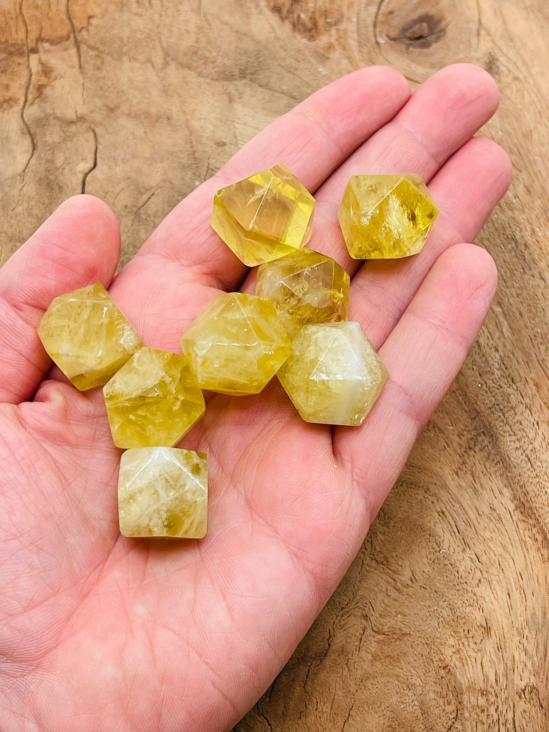 Citrine polyhedron carved gemstone, 20mm, from GemstoneGO, showcasing a vibrant yellow-orange crystal with faceted surface.