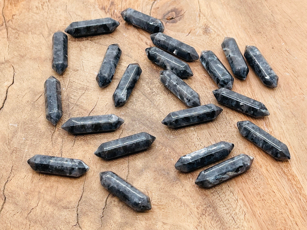 Larvikite terminated carved point gemstone, 33mm, from GemstoneGO, showcasing natural dark blue and black mineral patterns.