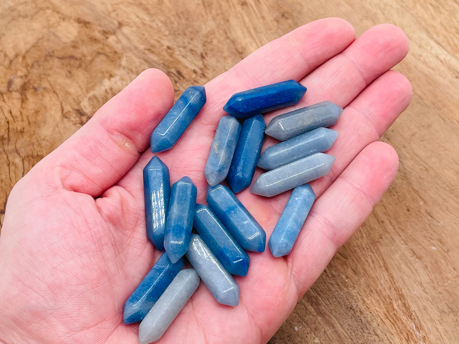 Blue aventurine terminated carved point gemstone, 33mm, with polished finish, from GemstoneGO, showcasing its vibrant blue color and natural patterns.