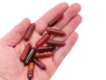 Carnelian terminated carved point gemstone, 33mm, from GemstoneGO, showing rich orange color and natural carved details.