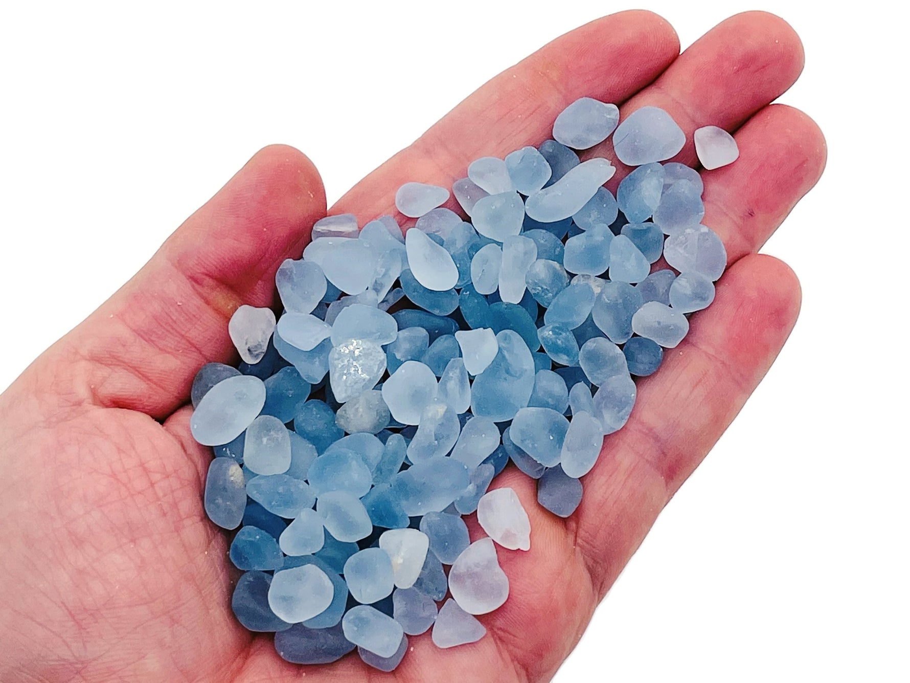 Semi-tumbled celestite crystal chips in 5-10mm size, natural gemstone bulk stones from GemstoneGO, showcasing blue, pearly mineral pieces.