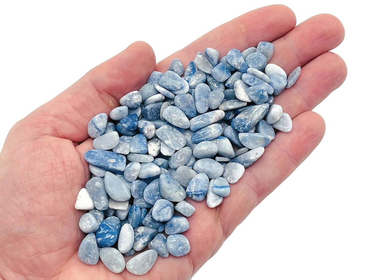 Blue Aventurine crystal chips, semi-tumbled 5-7mm gemstone from GemstoneGO, shown in a close-up of the bulk collection.