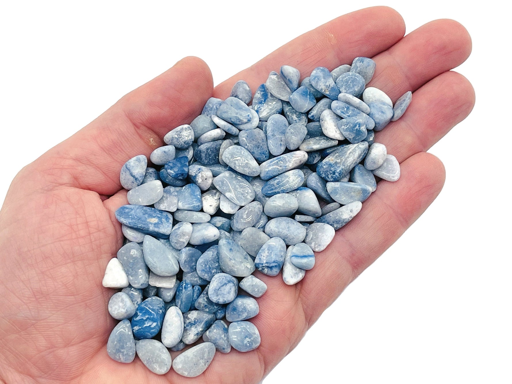 Blue Aventurine crystal chips, semi-tumbled 5-7mm gemstone from GemstoneGO, shown in a close-up of the bulk collection.